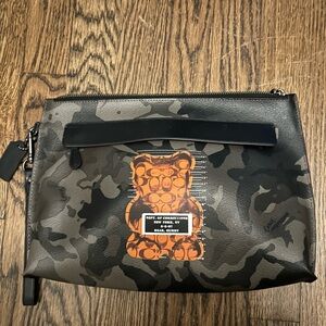 Coach gummy bear camouflage wristlet in great condition.
